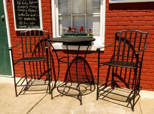 Two local restaurants: A blackboard displays the beer offerings at Touch Base ...