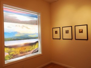 To the left, one of Vincent Bilotta's images on a window of the gallery; to the right, some of Dan Burkholder's scenic images