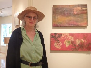 Dawn Potash poses with two of her creations